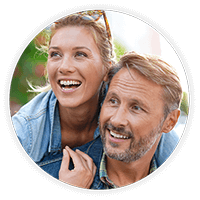 Young couple smiling after a cosmetic surgery